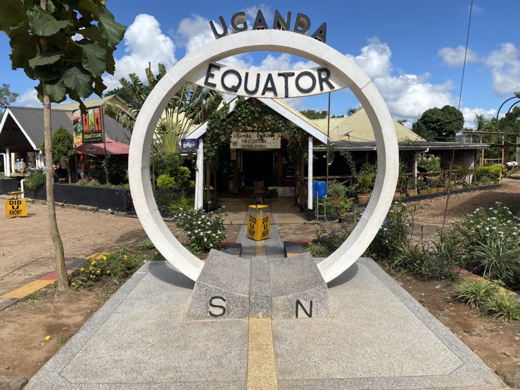 Visitors standing at the Equator line in Uganda